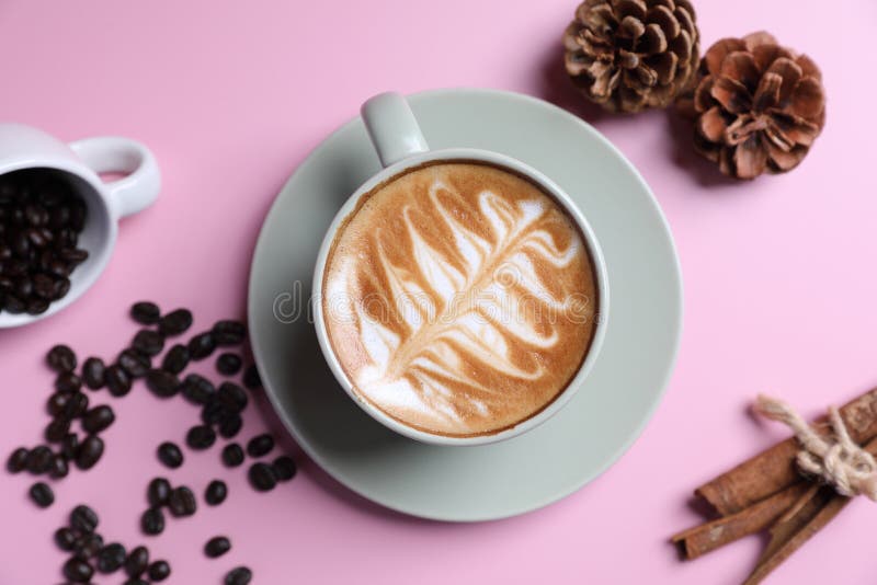 Hot Cappuccino with Latte Art Isolated in Pink Background Stock Photo