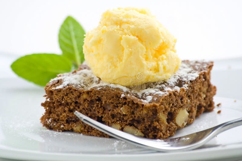 Hot chocolate brownie with walnuts and vanilla royalty free stock images