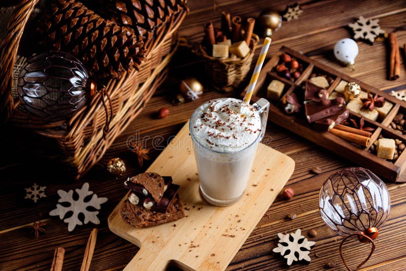 Hot chocolate drink with whipped cream. Cozy Christmas composition on a dark wooden background. Sweet treats for cold winter days. royalty free stock photo Hot chocolate drink with whipped cream. Cozy Christmas composition on a dark wooden background. Sweet treats for cold winter days. royalty free stock photo