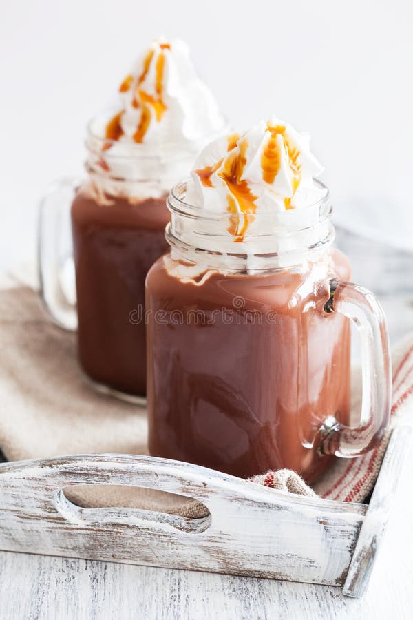 Hot Chocolate with Whipped Cream Caramel in Mason Jar Stock Photo