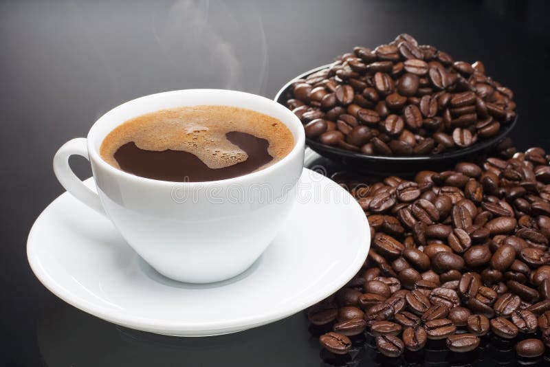 Coffee on coffeebeans stock photo. Image of drink, steam 13417276