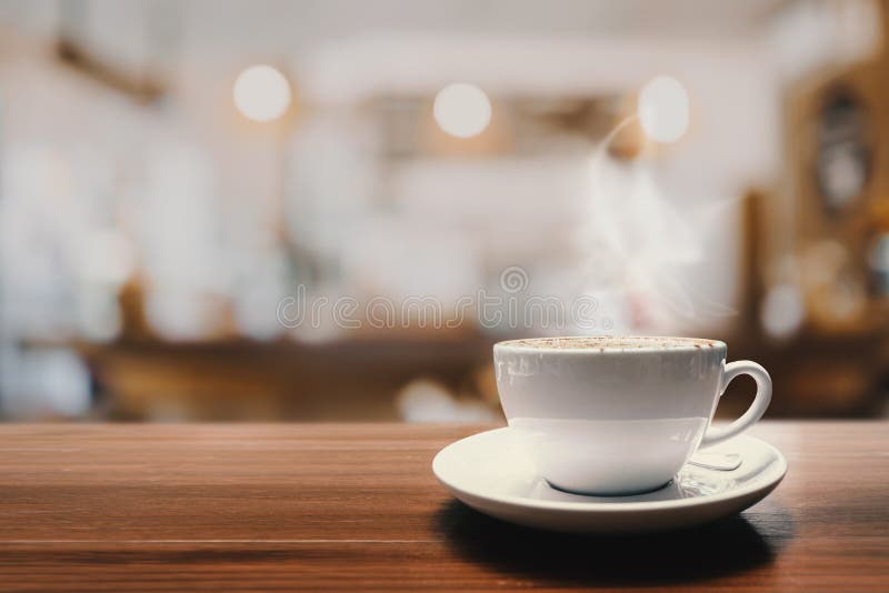 Hot Coffee Cup on Wood Table in Cafe for Background Stock Photo Image