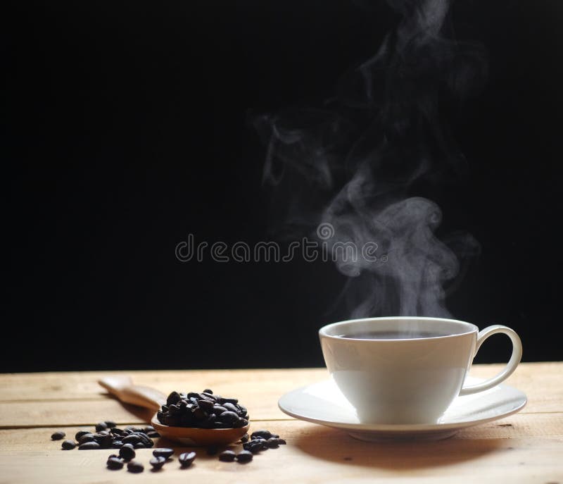 A Cup of Hot Coffee Smoke and a Book, Computer on Wood Table Stock