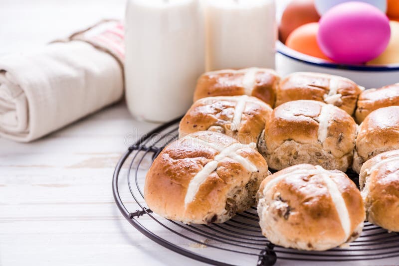 Hot Cross Bun on Tray with Easter Vibrant Eggs and Milk. Stock Image