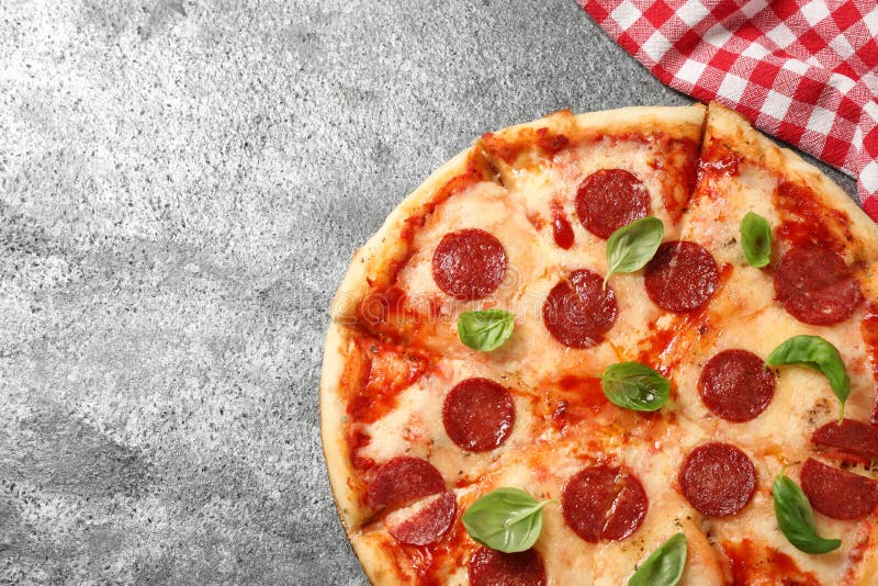 Hot delicious pepperoni pizza on table, top view. Space for text royalty free stock photography