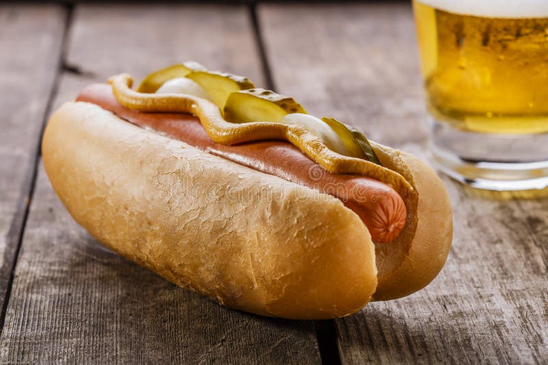 Hot Dog with Mustard, Pickles and Relish Sauce at Fast Food Restaurant