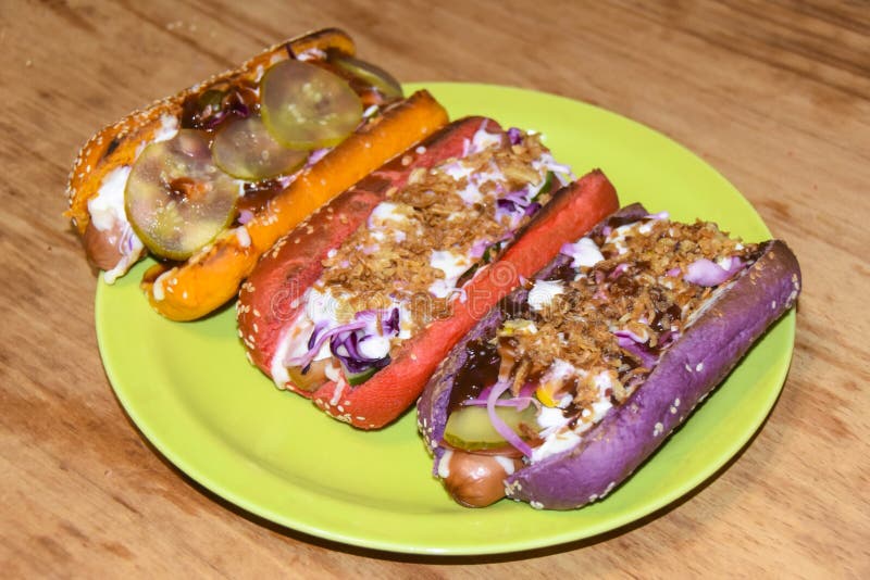 Hot Dogs Assorted Multi-colored Buns Different Toppings on Green Plate ...