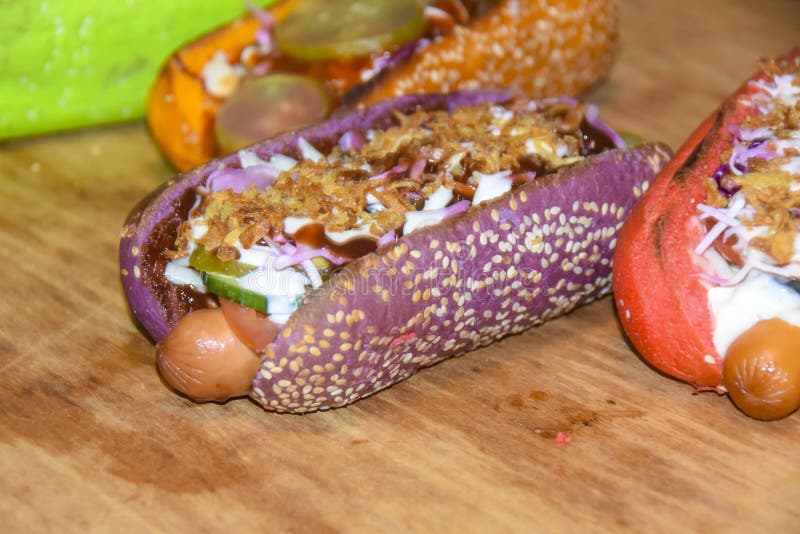 Hot Dogs Assorted Multi-colored Buns Different Toppings on Green Plate ...