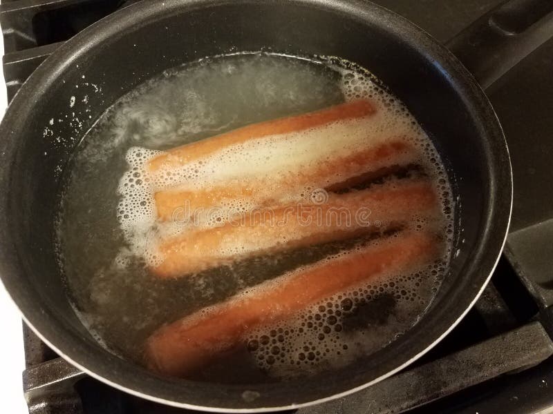 Hot Dogs Boiling in Water in Pan on Stove Stock Image Image of snack