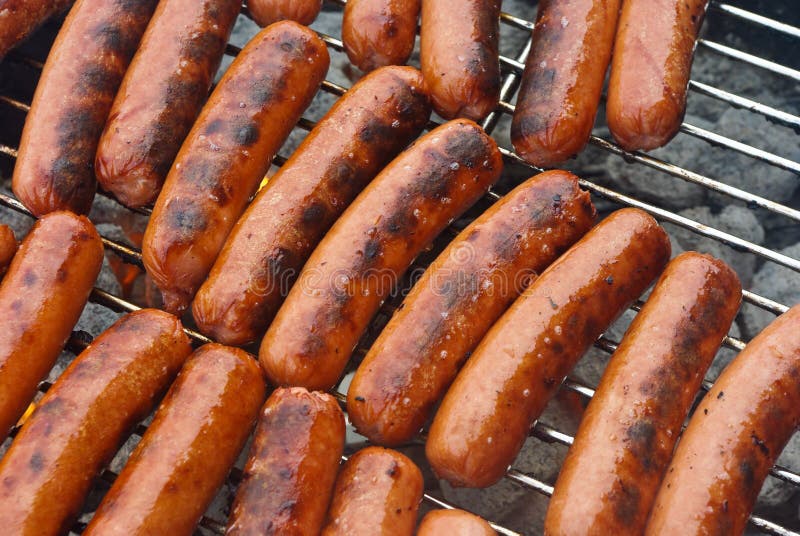Juicy Grilled Hot Dogs on a Charcoal Grill Stock Image Image of meal