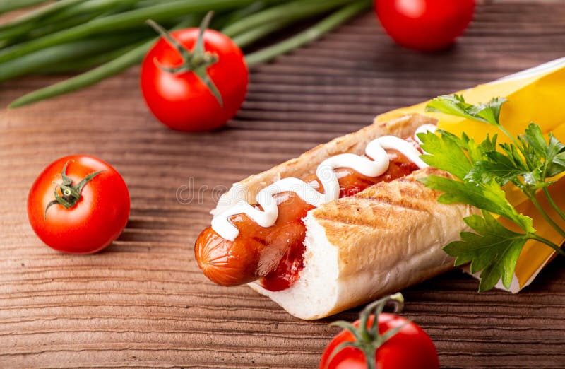 Hot Dogs, Cherry Tomatoes on Rusticbackground. Fast Food, American