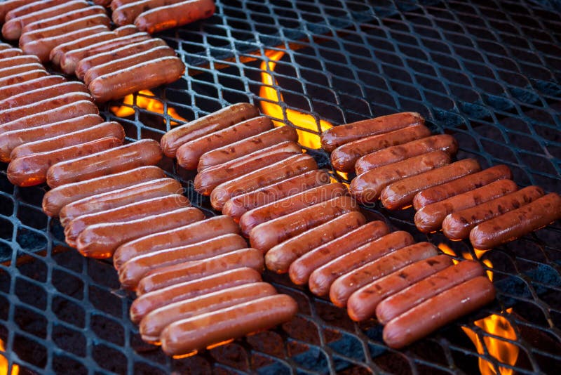 Hot Dogs on the Grill stock photo. Image of flame, franks 33442396