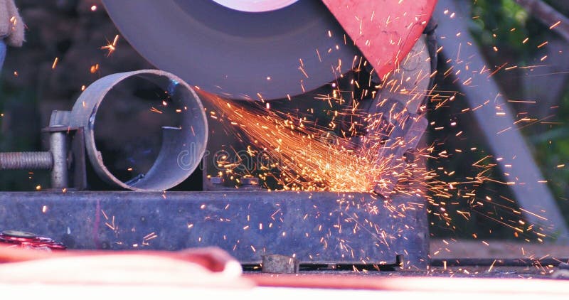 Hot flame welding metal work cutting fire iron workshop. Welding machine iron metal sparking. Locksmith using Welding machine royalty free stock photography