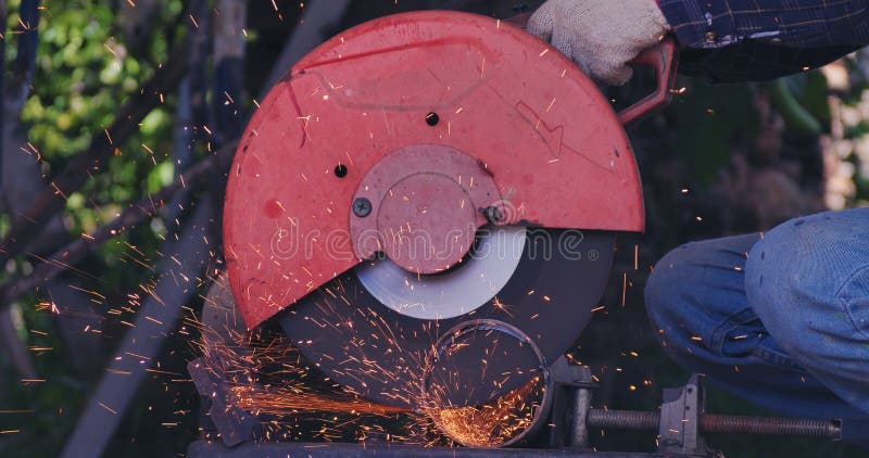 Hot flame welding metal work cutting fire iron workshop. Welding machine iron metal sparking. Locksmith using Welding machine royalty free stock image