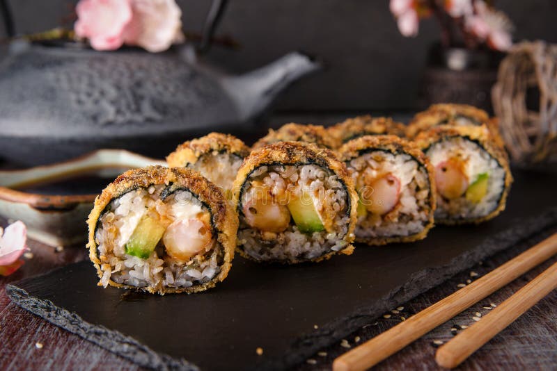 Hot fried Sushi Roll with shrimp, cucumber and unagi sauce.