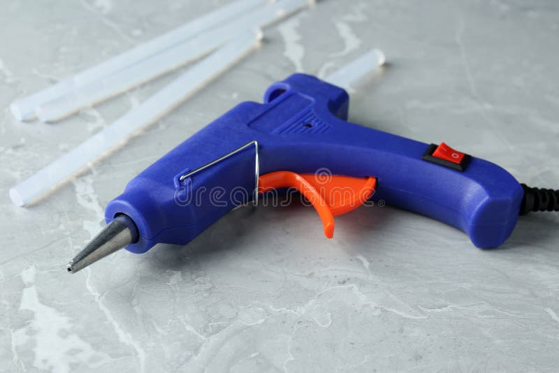 Hot Glue Gun and Sticks on Grey Marble Table Stock Image Image of
