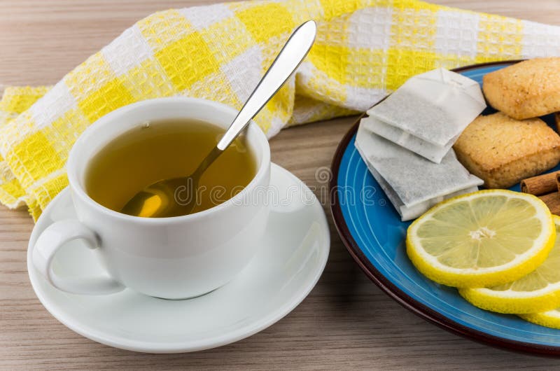 Hot Green Tea and Plate with Slices of Lemon, Cinnamon Stock Image