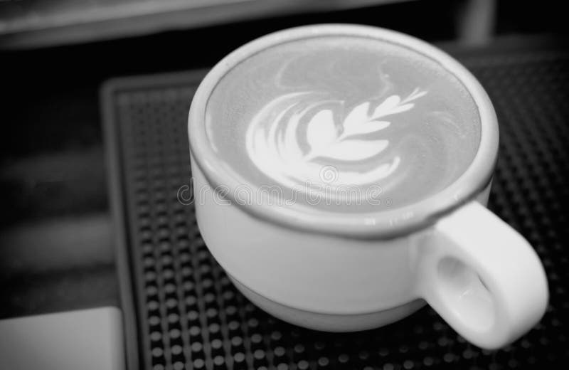 Hot Latte Coffee with Latte Art in White Ceramic Cup. Black and White