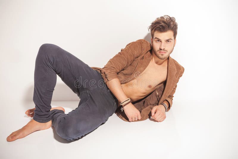 Casual Man Fashion Pose Lying Down Stock Photos - Free & Royalty-Free Stock Photos from Dreamstime