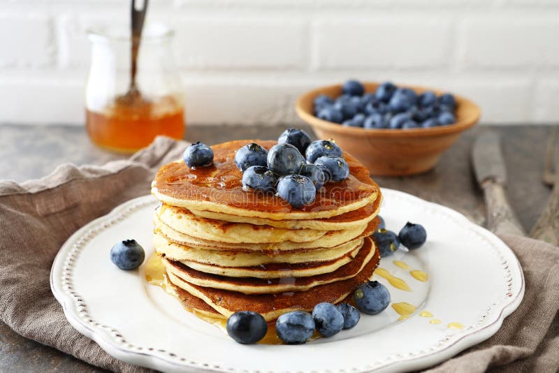 Hot pancakes in stack with berries royalty free stock photography