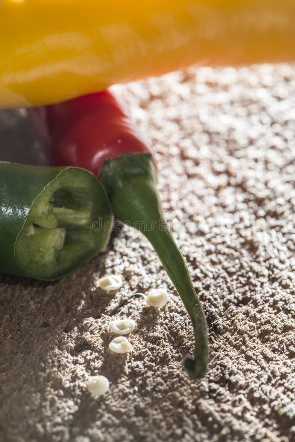 Hot peppers on wooden cutting board royalty free stock image
