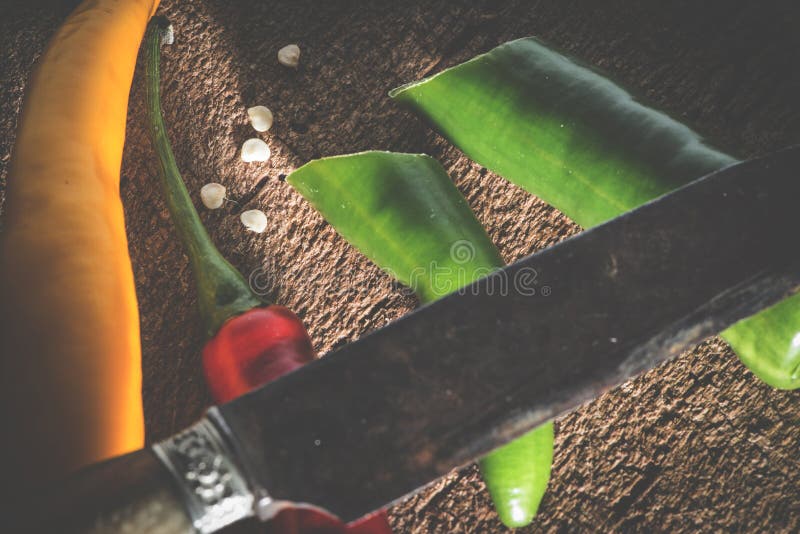 Hot peppers on wooden cutting board royalty free stock images