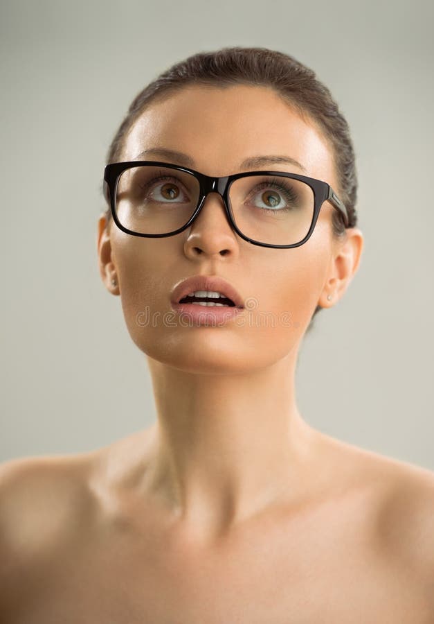 Hot naked woman wearing glasses. 