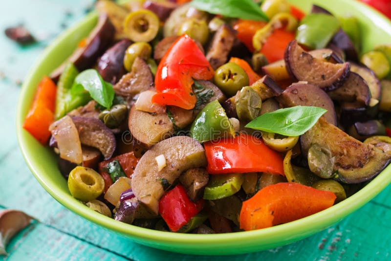 Hot spicy stew eggplant, sweet pepper, olives and capers. stock photos Hot spicy stew eggplant, sweet pepper, olives and capers. stock photos