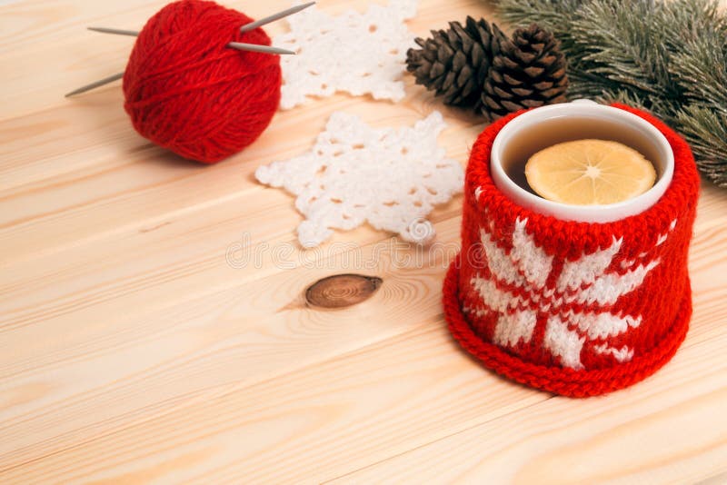 Hot tea, knitted Christmas decoration and fir tree branch royalty free stock photos Hot tea, knitted Christmas decoration and fir tree branch royalty free stock photos