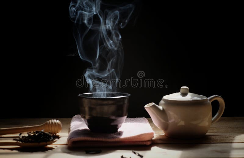 https://thumbs.dreamstime.com/b/hot-tea-teapot-cup-steam-wood-table-dark-background-winter-tea-time-cup-hot-tea-tea-pot-hot-smoke-dark-158027022.jpg