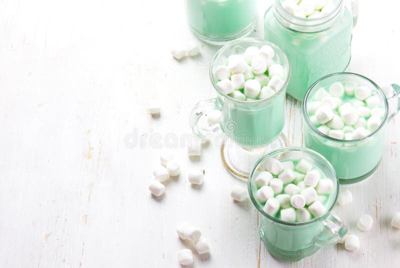 Hot white mint chocolate with marshmallows, white background. Holidey drink stock image