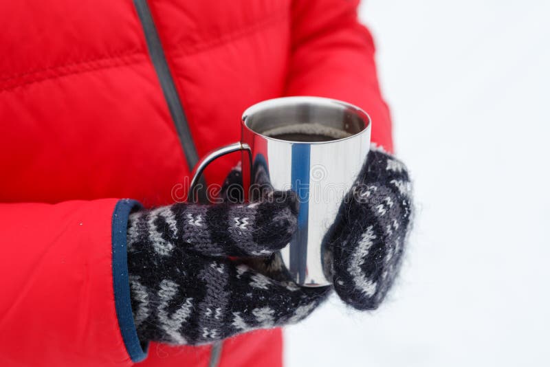 Hot winter drink on snow in forest. Cheerful, season.