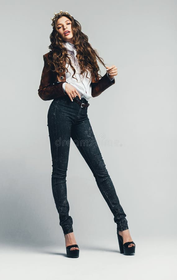 Hot woman in jeans and leather jacket