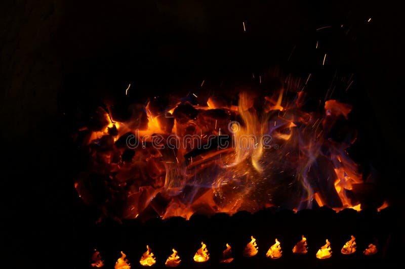 Hot Wood Coals Burn with Bright Flame in Iron Brazier Stock Image