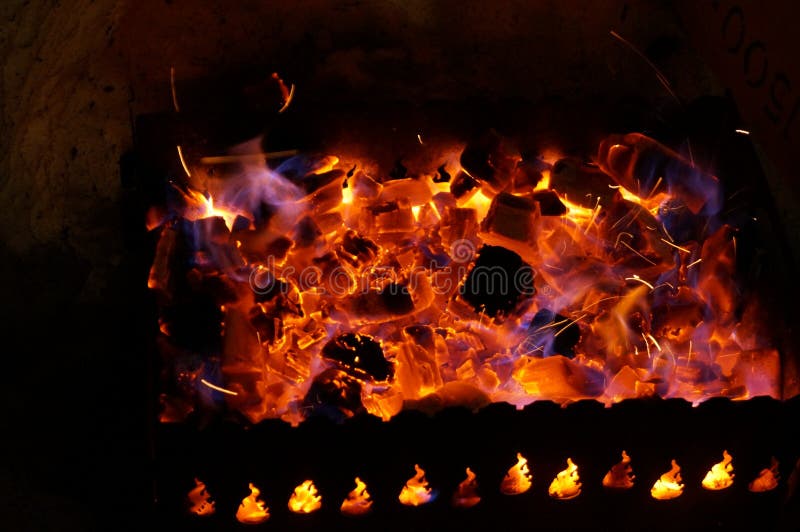 Hot Wood Coals Burn with Bright Flame in Iron Brazier Stock Photo