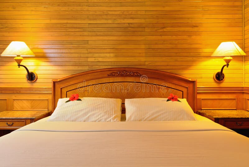 Hotel bed with lamps stock photo. Image of light, interior 12585264