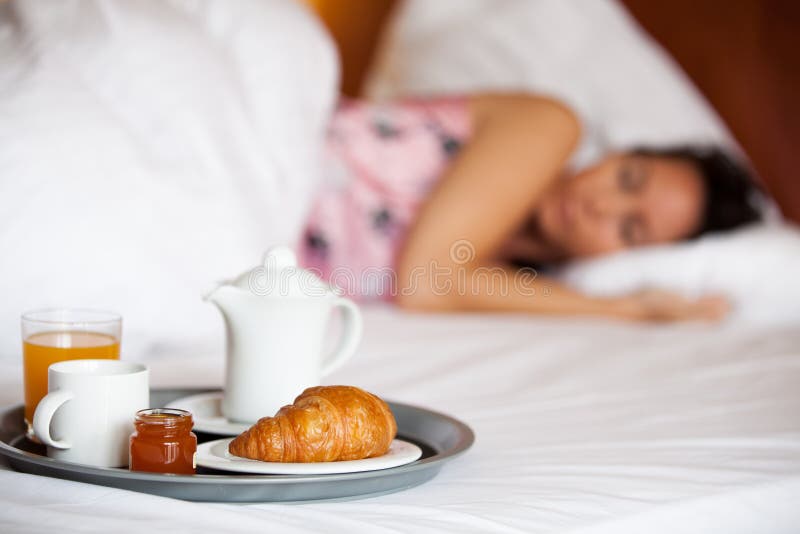 Hotel breakfast and a sleeping woman royalty free stock photography