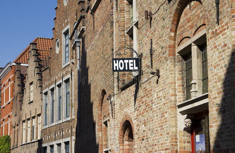 Sign saying Hotel in a Bruges street in Belgium. Sign saying Hotel in a Bruges street in Belgium