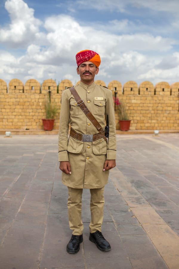 Hotel guard with moustache and traditional rajasthani turban posing for photo. stock photo Hotel guard with moustache and traditional rajasthani turban posing for photo. stock photo