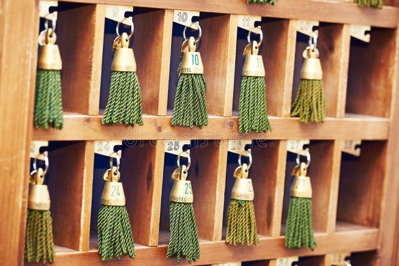 Hotel keys at reception desk counter royalty free stock photo