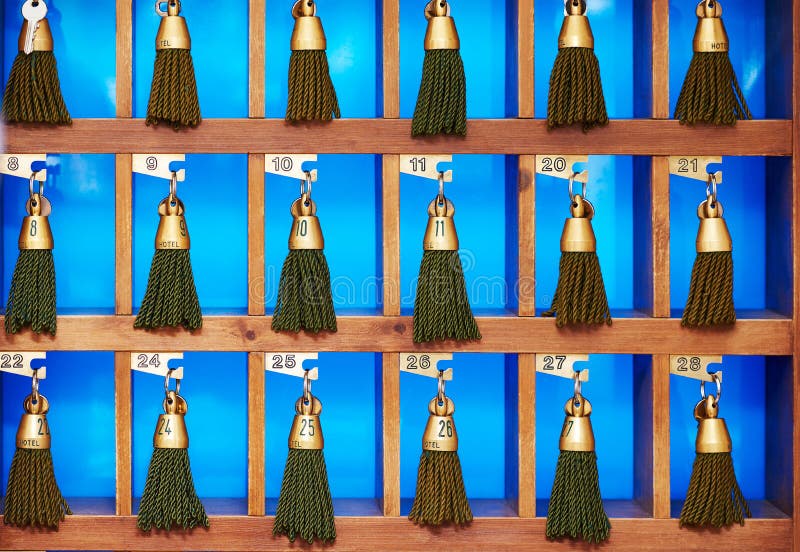 Hotel keys at reception desk counter royalty free stock photos