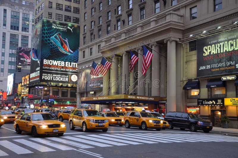 Hotel Pennsylvania Facade and yellow cab, at 7th Avenue (Fashion Avenue), Manhattan, New York City, USA. Hotel Pennsylvania Facade and yellow cab, at 7th Avenue (Fashion Avenue), Manhattan, New York City, USA