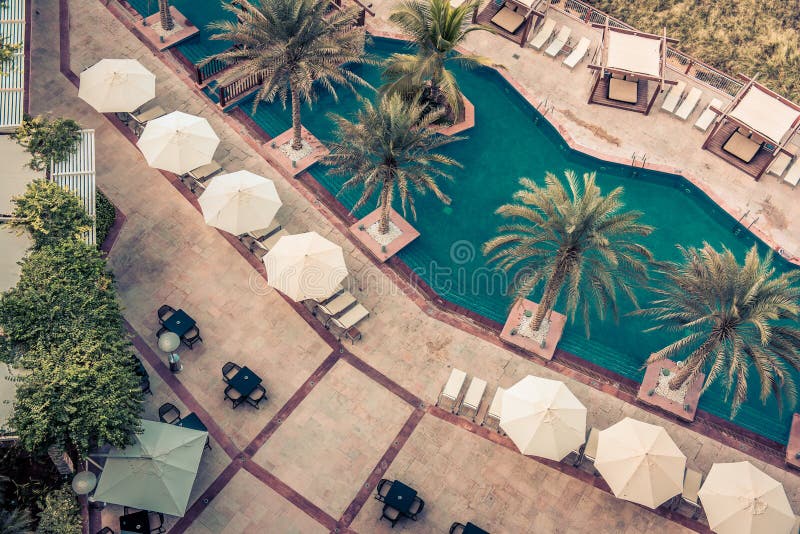 Hotel Poolside with Parasols and Palms stock photo Hotel Poolside with Parasols and Palms stock photo