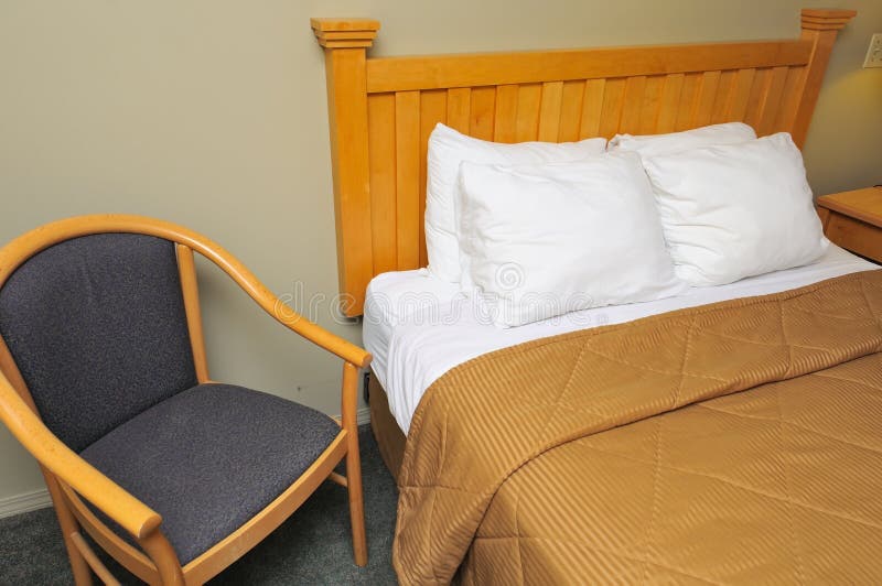 Hotel room with bed and chair