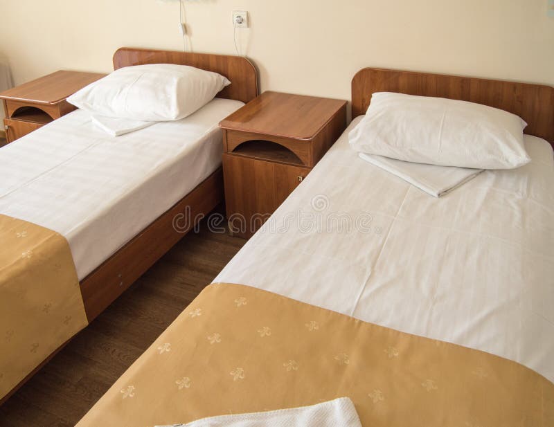Hotel Room with Two Empty SINGLE Beds and Bedside Tables, the Concept