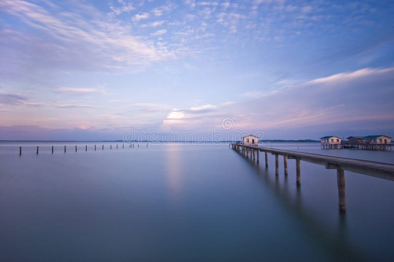 House with bridge at the lake stock photography
