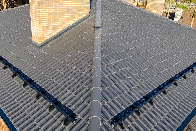 House with Ceramic Tile Roof. Cementsand Roof Tiles Stock Image