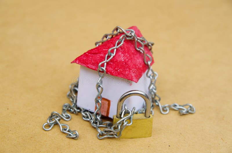 House in chains stock image. Image of house, security 18125725