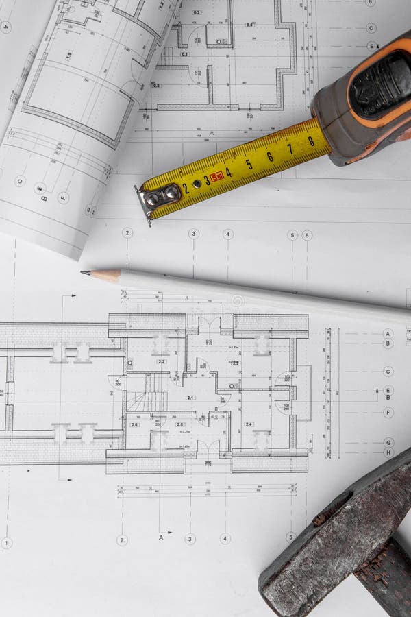 House Construction Plan. Hammer and Measuring Cup. Copy Space Stock
