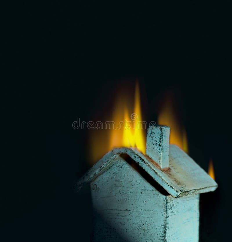 Burning toy house; metaphor for loss, crisis, insurance, real estate, danger. Burning toy house; metaphor for loss, crisis, insurance, real estate, danger